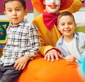 funny-clown-with-little-boy-in-kindergarten-2021-08-27-21-23-59-utc